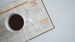 planner with coffee