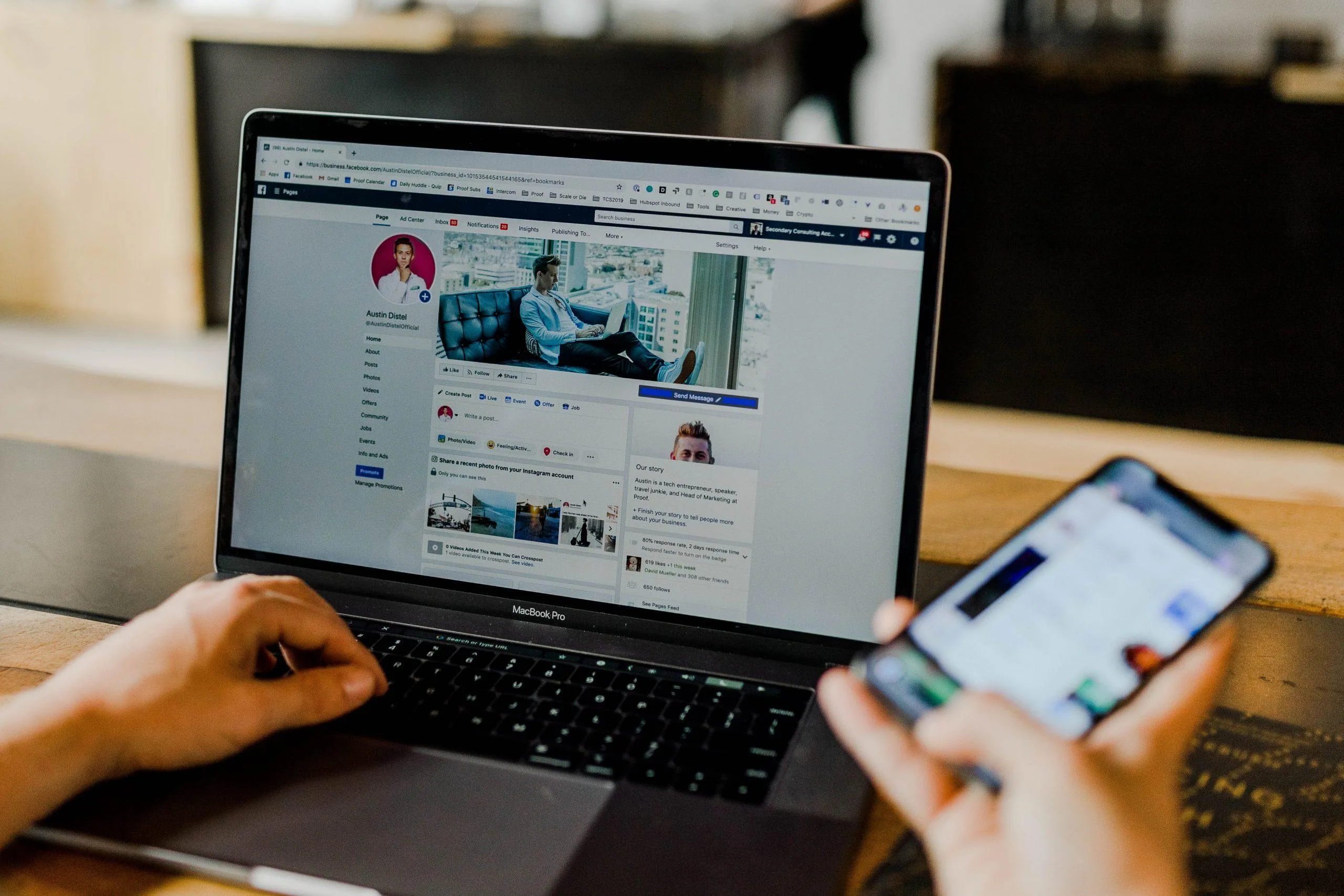 Laptop and mobile phone displaying Facebook profile